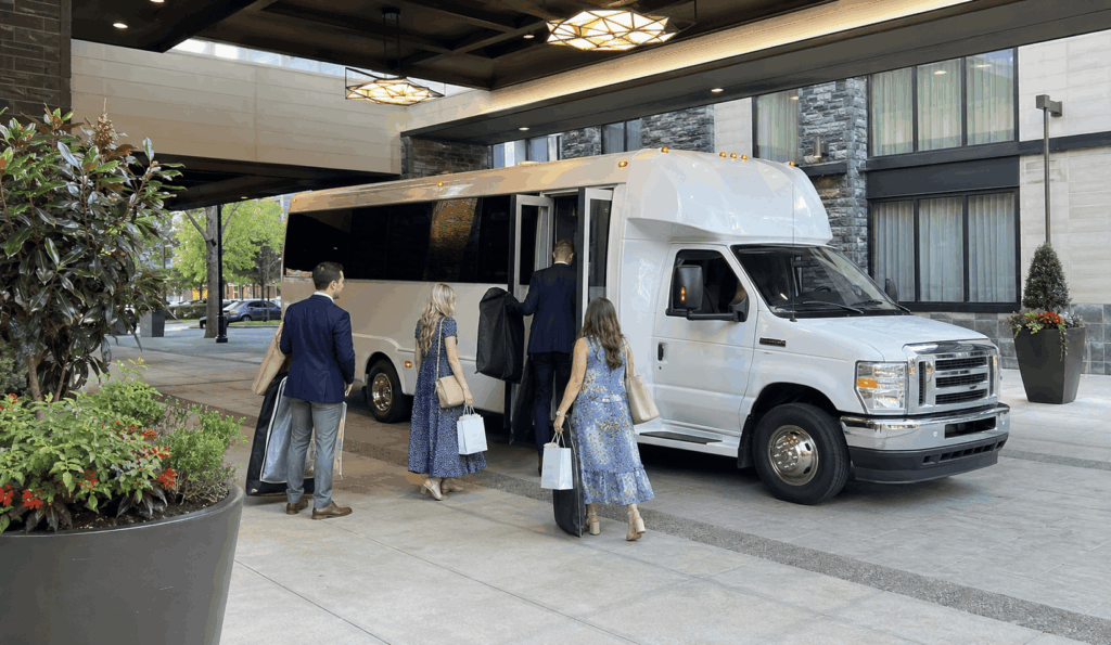 wedding guests boarding a shuttle outside a carmel hotel before traveling to the ceremony