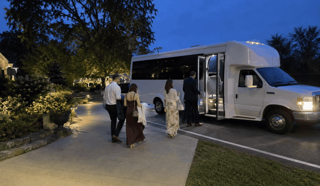 wedding guests boarding an evening shuttle after a reception in carmel, indiana