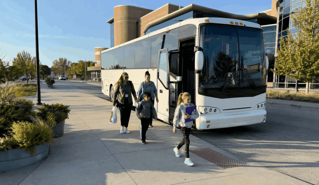 students arriving by charter bus for a field trip near the children’s museum of indianapolis