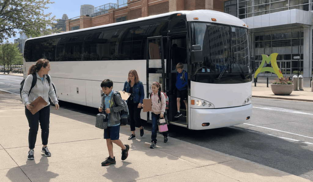 students arriving by charter bus for a field trip near the children’s museum of indianapolis