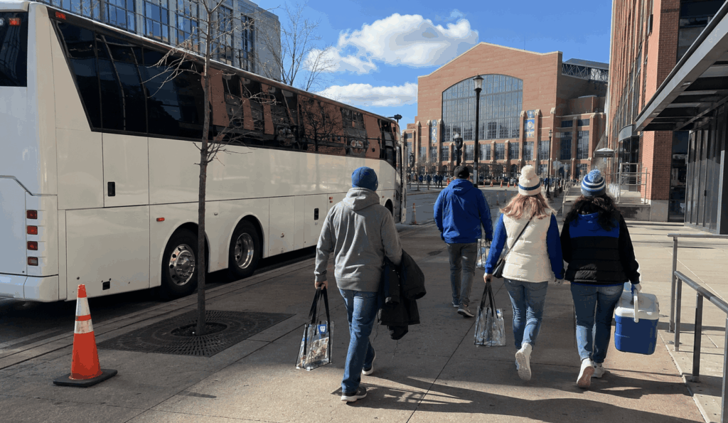 colts fans arriving by charter bus near lucas oil stadium in downtown indianapolis