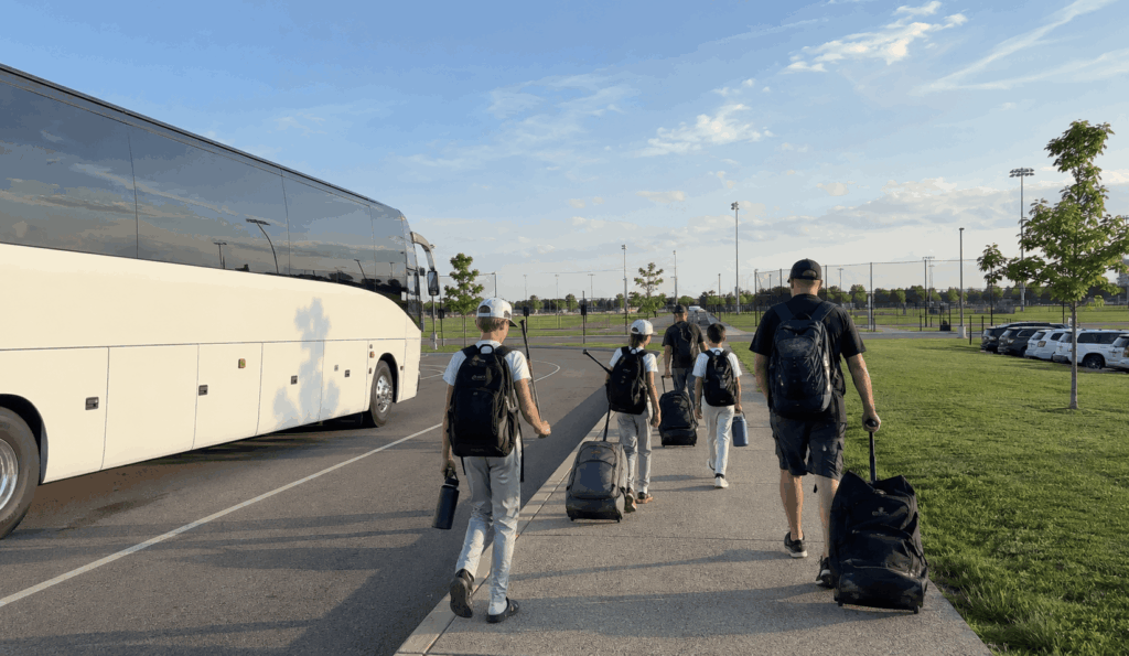 charter bus dropping off a sports group near lucas oil stadium in downtown indianapolis