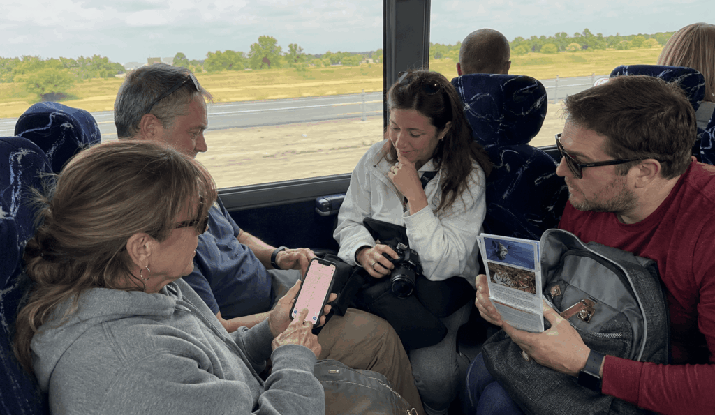 travelers riding a charter bus from indianapolis to cincinnati with zoo and riverfront day trip items
