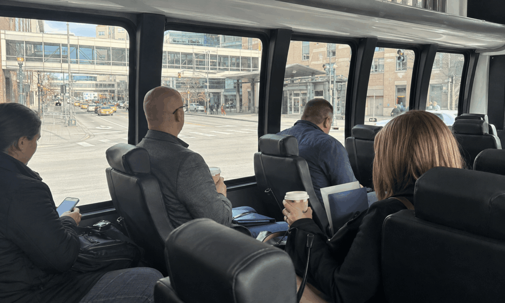 business conference attendees riding a clean shuttle bus to the indiana convention center