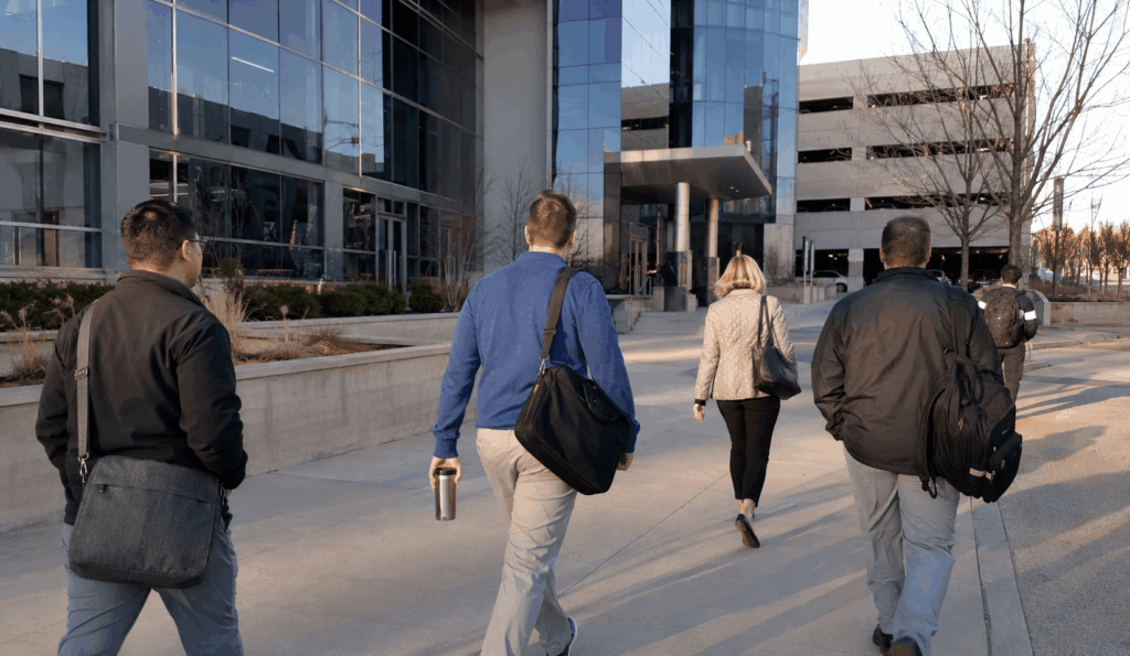 employees walking from an indianapolis office campus after arriving by commuter shuttle