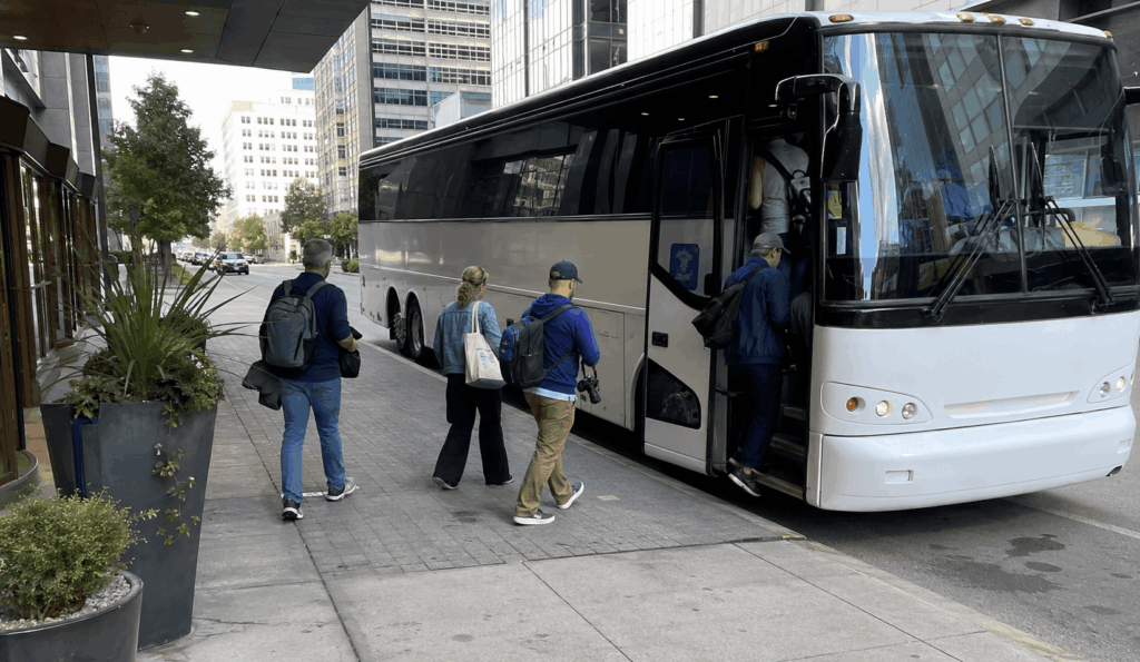 group boarding a charter bus in indianapolis for a day trip to louisville