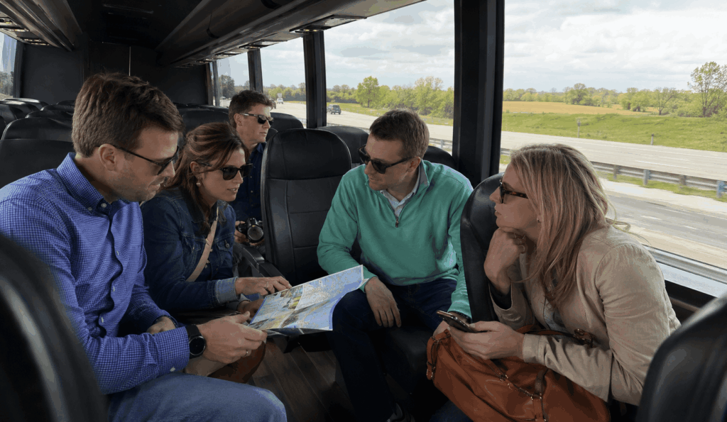 travelers riding a charter bus from indianapolis to louisville with day-trip items