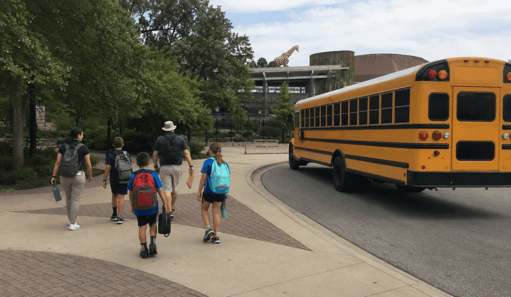 school group arriving by bus for a field trip near the indianapolis zoo
