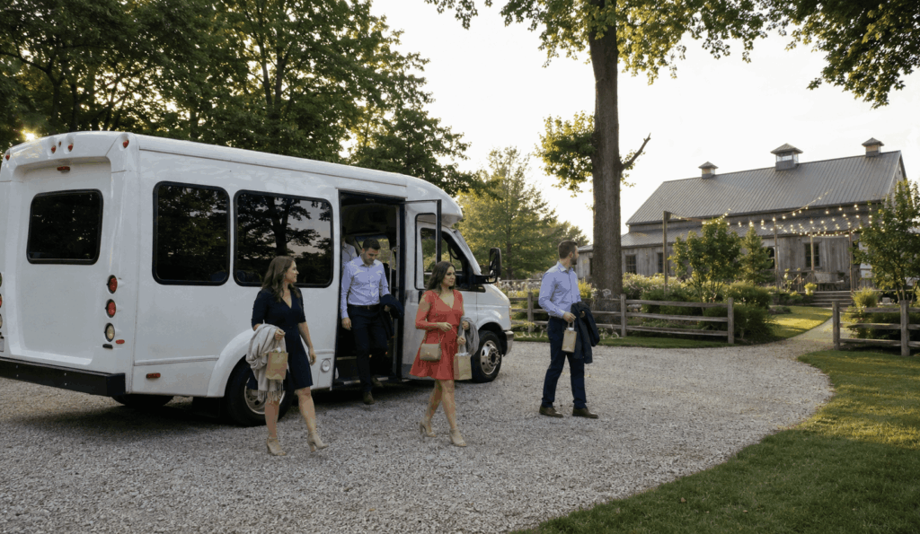 minibus shuttle dropping off wedding guests at a countryside farm venue in noblesville near indianapolis